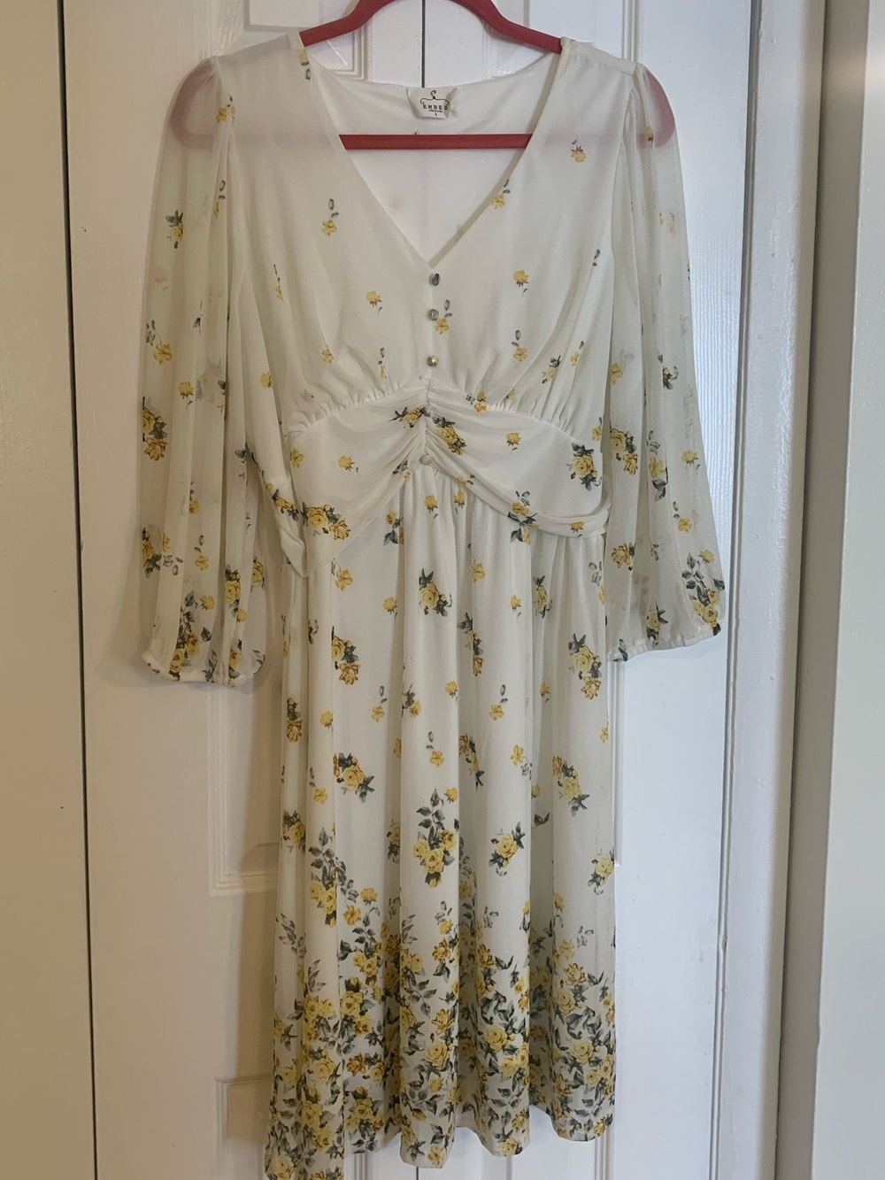 Elegant Cream Midi Dress with Yellow Floral Print and V-Neck Detail